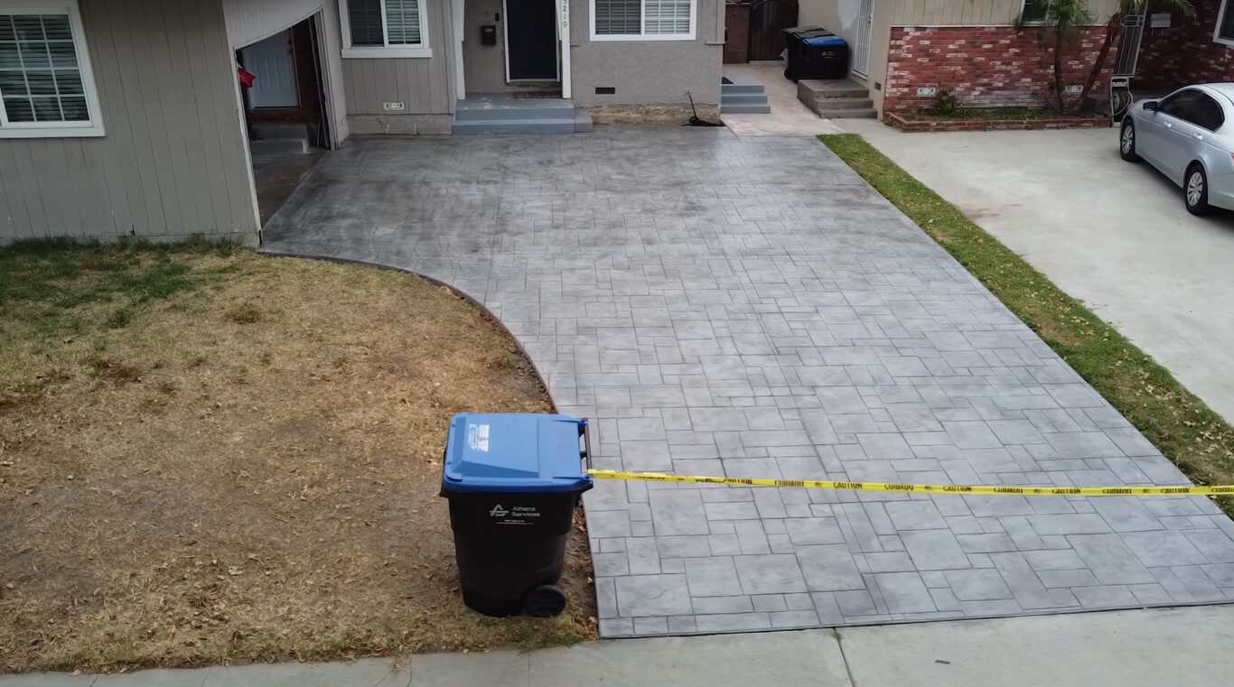 Stamped decorative concrete driveway with brick pattern